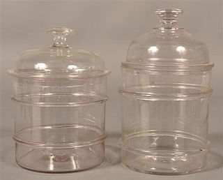 Two Antique Blown Colorless Glass Canisters.