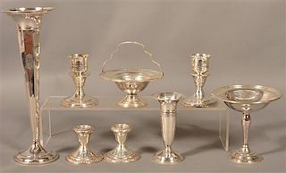 Eight Various Sterling Weighted base Pieces.