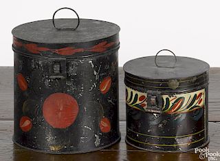 Two toleware canisters, 19th c., with floral decoration, 4 3/4'' h. and 7'' h.
