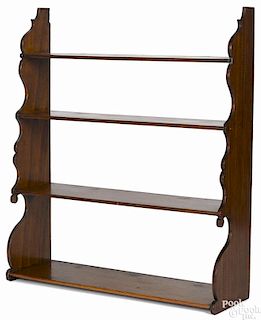 Mahogany hanging shelf, 19th c., with scalloped sides, 33 1/2'' h., 28 1/2'' w.