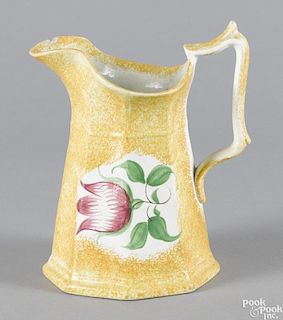 Yellow spatter pitcher, 19th c., with tulip decoration, 7 3/4'' h.
