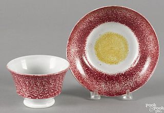 Red and yellow rainbow spatter bull's-eye cup and saucer.