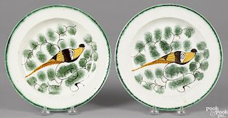 Pair of pearlware green feather edge plates with peafowl decoration, 9'' dia.