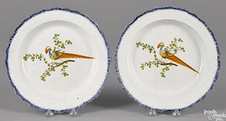 Pair of pearlware blue feather edge plates, 19th c., with peafowl decoration, 9 3/4'' dia.