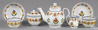 Miniature pearlware tea service, 19th c., with floral decoration, teapot - 4 1/4'' h.