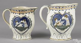 Two Pratt pearlware mischievous pitchers, 19th c., 8'' h. and 7 1/4'' h.