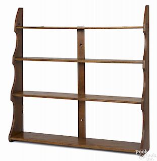 Mahogany hanging shelf, late 19th c., with scalloped sides, 36 1/4'' h., 36 1/2'' w.
