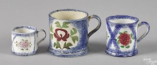Three blue spatter mugs with strawberry thumbprint and Adam's rose decoration