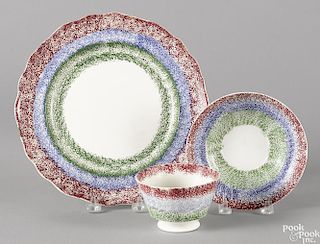 Red, blue, and green rainbow spatter, to include a plate, 9 3/8'' dia., and a cup and saucer.