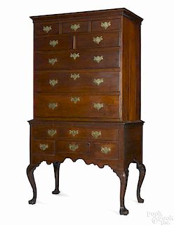 Pennsylvania Queen Anne walnut high chest, ca. 1770, the upper section with five short drawers