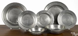 Seven pieces of English pewter, to include a Graham & War drop basin, two chargers, two plates