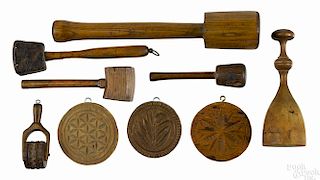 Woodenware, 19th c., to include three butter prints, five mallets, and a pastry wheel.