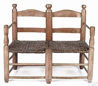 Child's painted ladderback settee, early 19th c., retaining an old salmon surface, 28'' h.