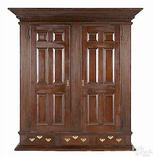 Pennsylvania walnut schrank, late 18th c., with raised panel doors and sides