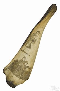 Scrimshaw decorated porpoise jawbone, 19th c., depicting a caped man, above a scene of two figures
