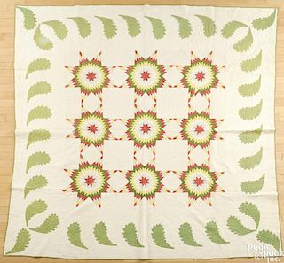 Pieced and appliqué star pattern quilt, late 19th c., 85'' x 85''.
