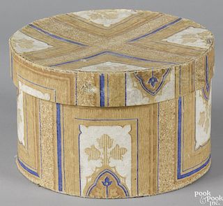 New England wallpaper covered hatbox, 19th c., 6 1/4'' h., 9 1/2'' w.