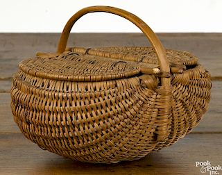 Small woven basket, dated 1899, with a double hinged lid, initialed on handle R.A.D., 7'' h.