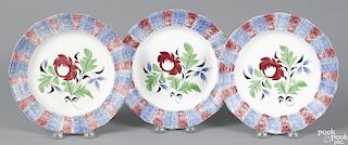 Three blue and red rainbow spatter plates with Adam's Rose decoration, 8 1/2'' dia.