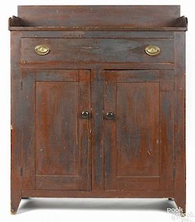 Pennsylvania painted poplar jelly cupboard, 19th c., retaining an old dry red surface, 51 1/2'' h.