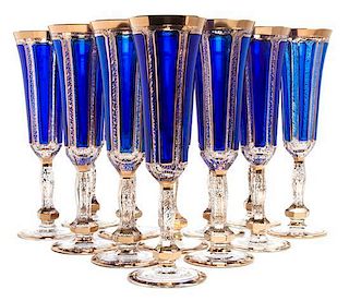 * A Set of Twelve Parcel Gilt Cobalt and Clear Glass Champagne Flutes Height 9 inches.