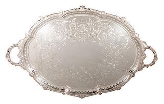 * An English Silverplate Serving Tray, Goldsmiths & Silversmiths Co., London, of oval two-handled form, having an engraved desig