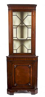* A Chippendale Style Mahogany Corner Cabinet Height 71 1/4 x width 25 1/2 inches.