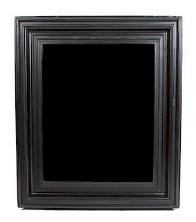 * An Ebony Framed Mirror Height 47 x width 41 inches.