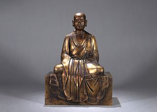 A gilt copper buddha statue