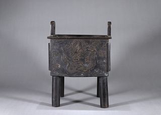 A dragon patterned copper pot