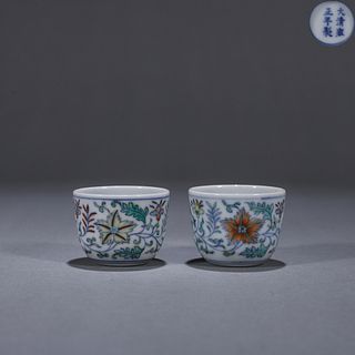A pair of doucai interlocking flower porcelain cups