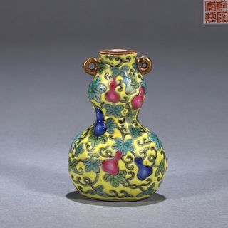 A yellow ground famille rose gourd porcelain snuff bottle