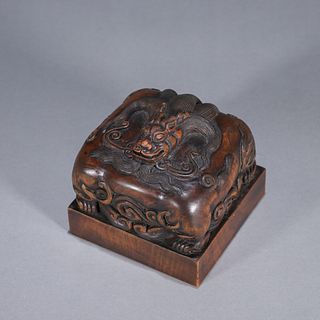 A rosewood carved beast seal