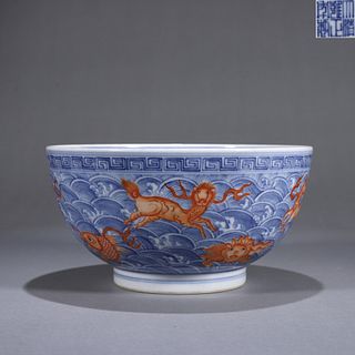A blue and white seawater and iron red sea beast porcelain bowl