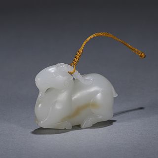 A goat shaped jade pendant