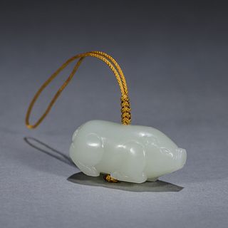 A pig shaped jade pendant