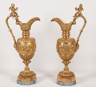PAIR OF FRENCH DORE BRONZE PUTTI MOUNTED EWERS