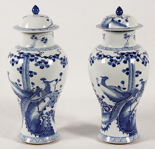 PAIR OF DECORATIVE CHINESE PORCELAIN BLUE AND WHITE CAPPED JARS