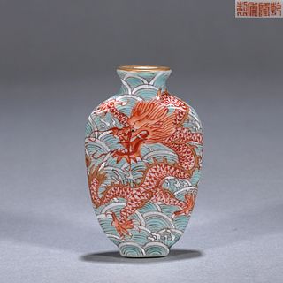 A green and red dragon porcelain snuff bottle