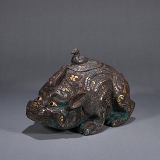 A beast shaped gold and silver inlaid bronze incense burner