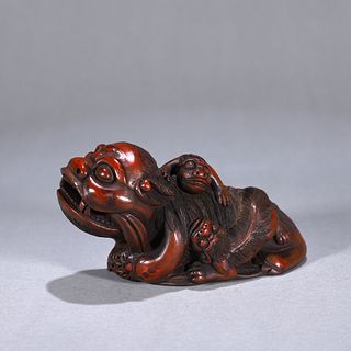 A bamboo carved lion ornament