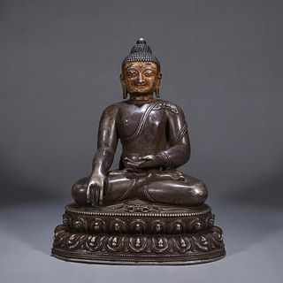 A silver buddha statue