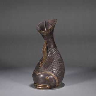 A fish shaped silver pot