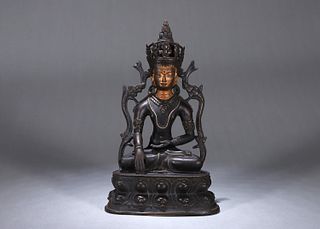 A gilt copper buddha statue