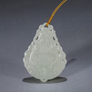 An inscribed jade pendant