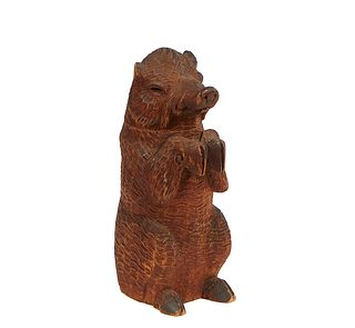 Black Forest Carved Bear Tobacco Jar, 19th c., the standing figure with a hinged head opening to a hollow interior, signed illegibly on the bottom and