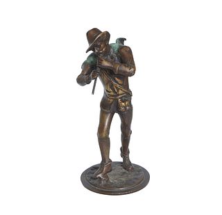 Continental School, "The Pied Piper," 20th c., patinated bronze, on an integral stepped circular base, H.- 10 1/2 in., Dia.- 4 1/2 in.