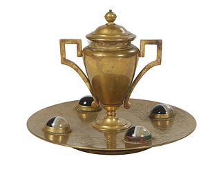 Gilt Bronze Art Nouveau Inkwell, late 19th c., the lidded handled urn ink pot with a porcelain insert, on a circular footed base with incised leaf and