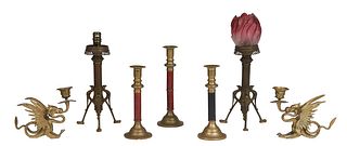 Group of Six Brass Candlesticks, consisting of a pair of winged gryphon examples, 20th c.; a pair of patinated bronze examples on tripodal bird form l