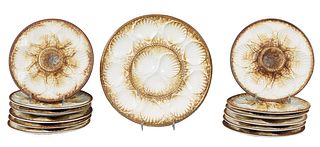 French Majolica Thirteen Piece Oyster Set, 20th c., consisting of twelve circular plates and a large circular platter, Platter- H.- 1 in., Dia.- 13 in